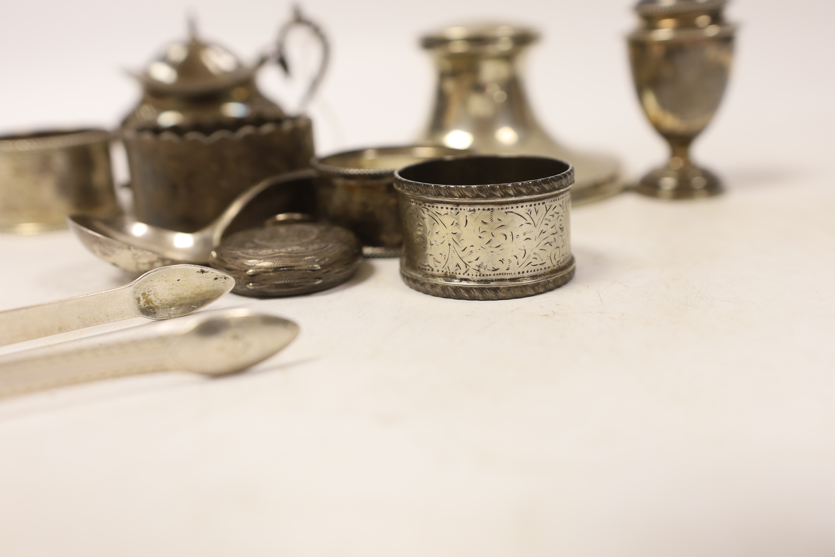 Sundry small silver including a capstan inkwell, napkin rings, condiments, fob watch and pair of Georgian sugar tongs.